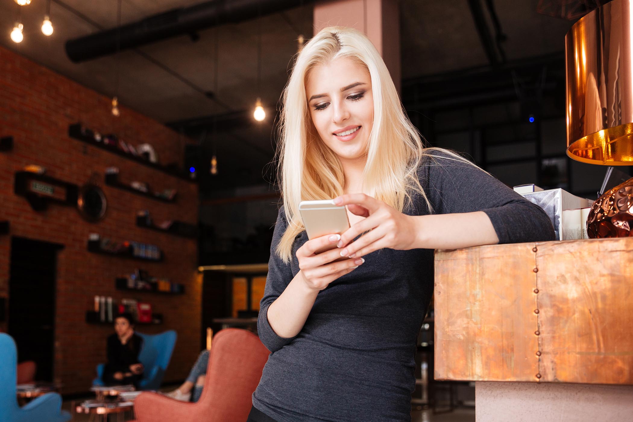 beauty therapist hairdresser on mobile phone