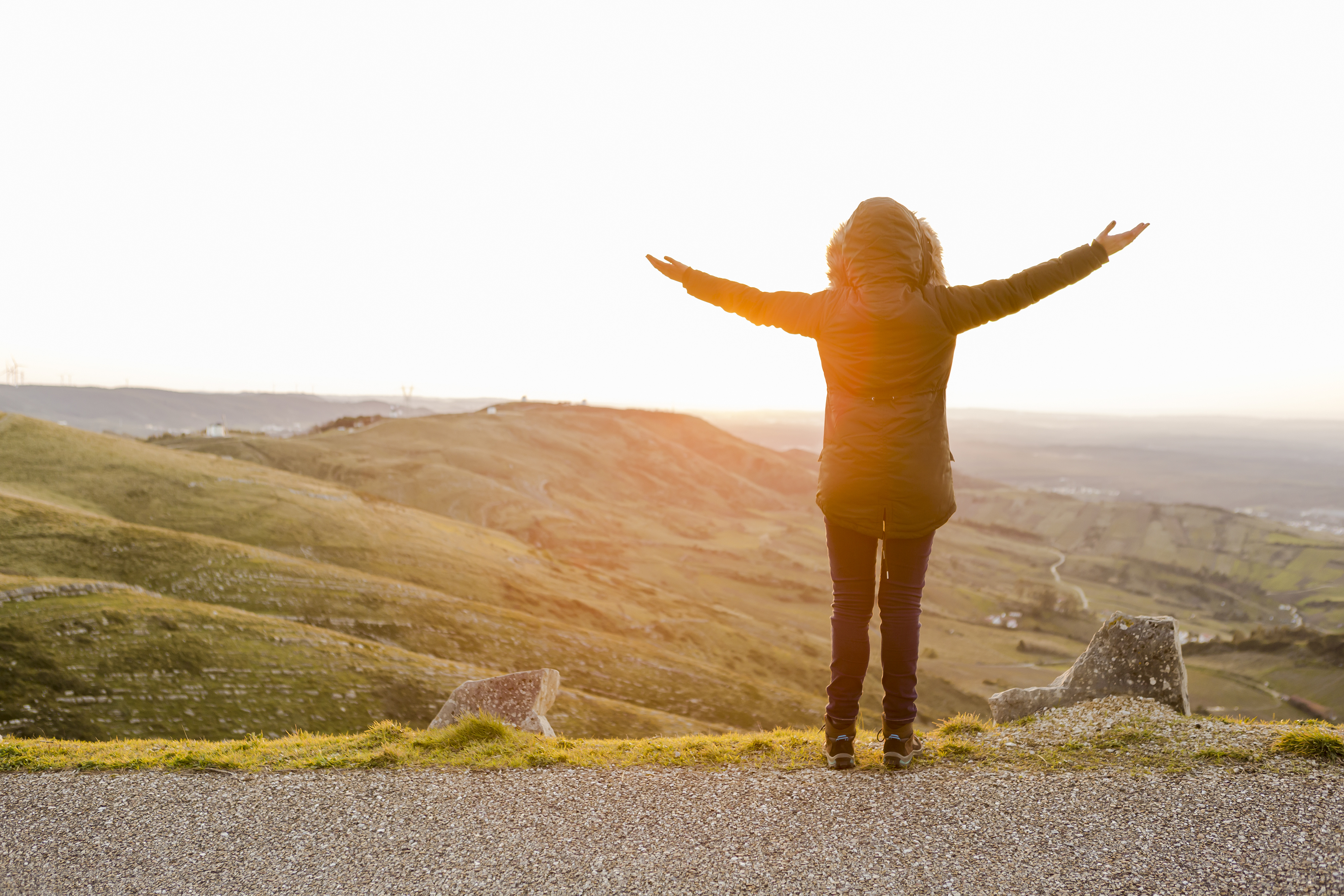 Woman outdoors re-wilding in nature landscape