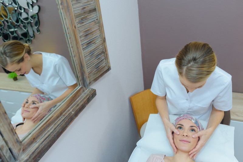 Cancer patient having facial treatment